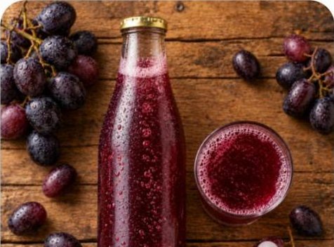 Grape kombucha bottle and glass